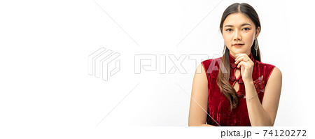 Young beautiful Chinese woman in traditional Chinese dress looking and smiling at camera on white background Young beautiful Chinese woman in traditional Chinese dress looking and smiling at camera on white background 74120272