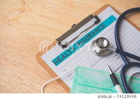 Stethoscope and calculator placed on health insurance documents, Individual medical health insurance. Concept life planning Stethoscope and calculator placed on health insurance documents, Individual medical health insurance. Concept life planning 74120436