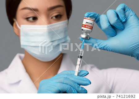 Coronavirus Immunization. Doctor With Syringe Taking Dose Of Covid-19 Vaccine From Vial Coronavirus Immunization. Doctor With Syringe Taking Dose Of Covid-19 Vaccine From Vial 74121692