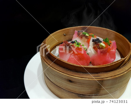Chinese dim sum steamed scalloop dumplings in bamboo basket Chinese dim sum steamed scalloop dumplings in bamboo basket 74123031