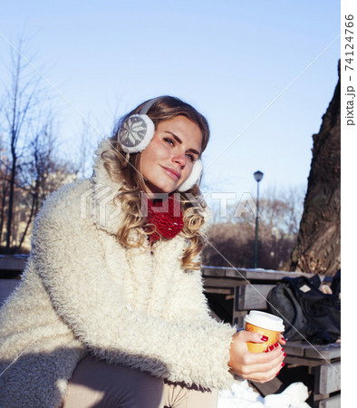 young pretty teenage hipster girl outdoor in winter snow park having fun, lifestyle people concept young pretty teenage hipster girl outdoor in winter snow park having fun, lifestyle people concept 74124766
