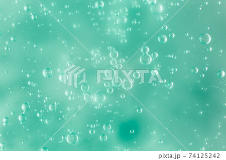 Liquid cream gel, green blue cosmetic texture with bubbles Liquid cream gel, green blue cosmetic texture with bubbles 74125242