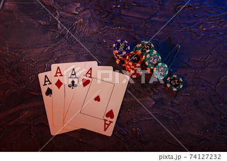 Online gambling сoncept. Aces and gambling chips. Top view Online gambling сoncept. Aces and gambling chips. Top view 74127232