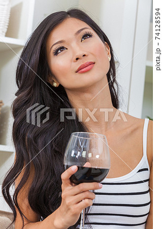 Beautiful Young Asain Woman or Girl Drinking Red Wine 74128594