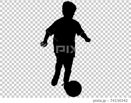 Silhouette of a boy dribbling 74130342
