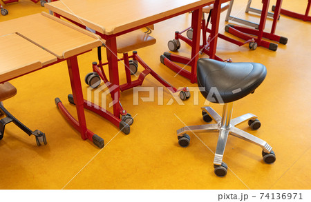 Saddle chair in a classroom 74136971