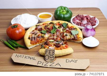 tasty pizza closeup with spice for pizza day 74137071
