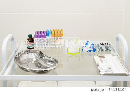 Blood tubes in tray in medical lab. Empty blood tube tests ready for analysis in the laboratory of haematology. 74138164