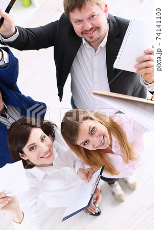 Group of joyful happy people in suits celebrate win Group of joyful happy people in suits celebrate win 74141109