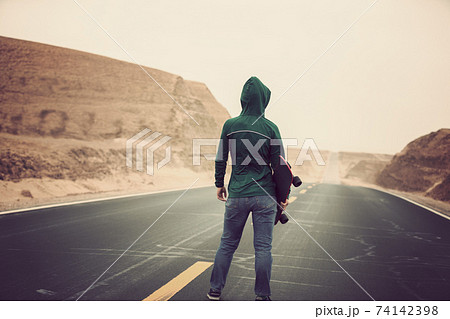 Woman skateboarder skateboarding in the wide world 74142398