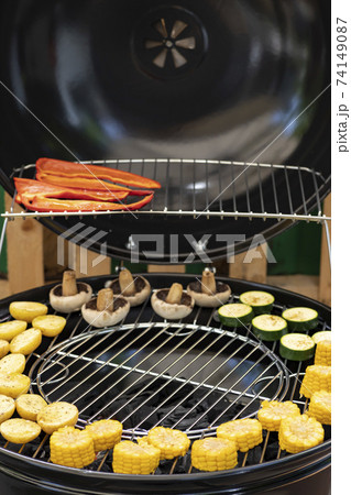 grill with potatoes, turkey meat, zucchini, mushrooms and sausages 74149087