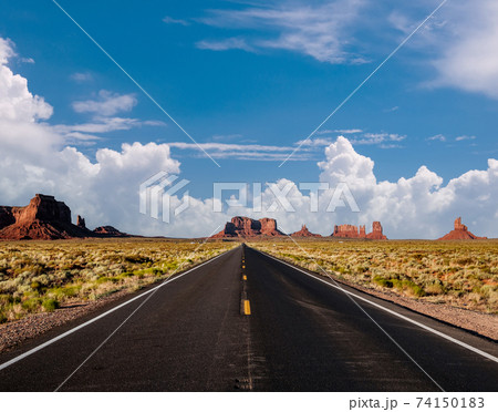 Empty scenic highway in Monument Valley Empty scenic highway in Monument Valley 74150183
