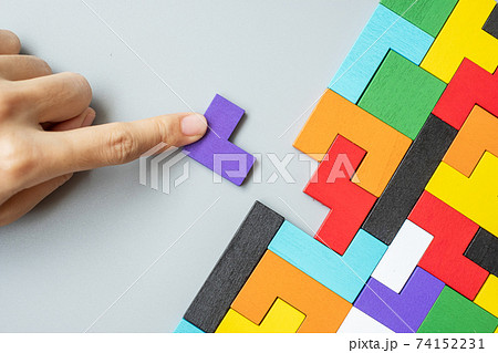 hand connecting geometric shape block with colorful wood puzzle pieces. logical thinking, business logic, Conundrum, decision, solutions, rational, mission, success, goals and strategy concepts hand connecting geometric shape block with colorful wood puzzle pieces. logical thinking, business logic, Conundrum, decision, solutions, rational, mission, success, goals and strategy concepts 74152231