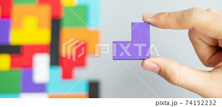 hand connecting geometric shape block with colorful wood puzzle pieces. logical thinking, business logic, Conundrum, decision, solutions, rational, mission, success, goals and strategy concepts hand connecting geometric shape block with colorful wood puzzle pieces. logical thinking, business logic, Conundrum, decision, solutions, rational, mission, success, goals and strategy concepts 74152232