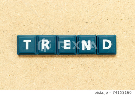 Tile alphabet letter in word trend on wood background 74155160