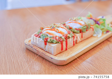bread, avocado sauce, bacon, spinach, egg benedict on the white plate and old wood background, avocado sauce combine avocado and tomatoes, breakfast bread, avocado sauce, bacon, spinach, egg benedict on the white plate and old wood background, avocado sauce combine avocado and tomatoes, breakfast 74155758