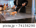 Hand of Chef cooking salmon steak 74156290