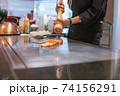 Hand of Chef cooking salmon steak 74156291