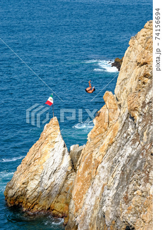 Cliff Divers jump at La Quebrada - Acapulco - Mexico Cliff Divers jump at La Quebrada - Acapulco - Mexico 74156694
