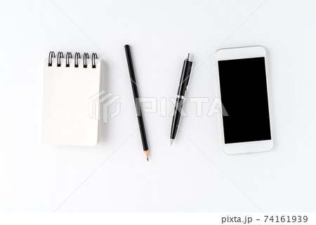 White background with phone and accessories. Office desktop White background with phone and accessories. Office desktop 74161939