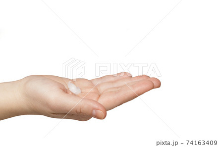 Female caucasian hand slightly bent palm with cream isolated on white background Female caucasian hand slightly bent palm with cream isolated on white background 74163409
