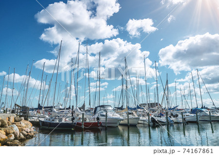 Sailing boats in a marine harbor in the summer 74167861