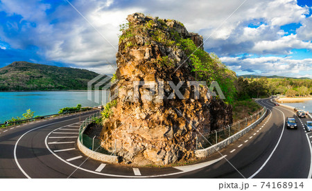 Beautiful ring road with rock - popular attraction in Mauritius island 74168914