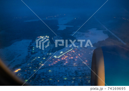 view of aircraft turbine through porthole 74169695