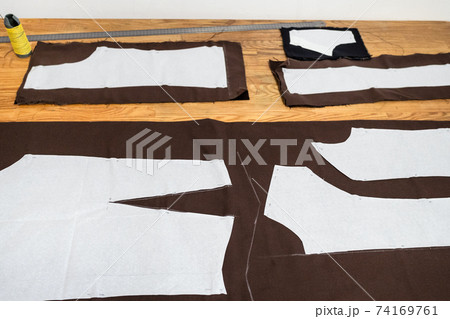 view of layouts of sewing patterns on wooden table view of layouts of sewing patterns on wooden table 74169761
