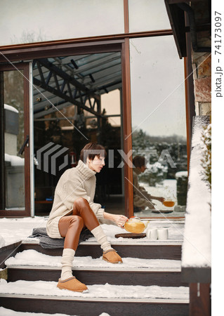 Outdoor photo of cozy female on the terrace Outdoor photo of cozy female on the terrace 74173097