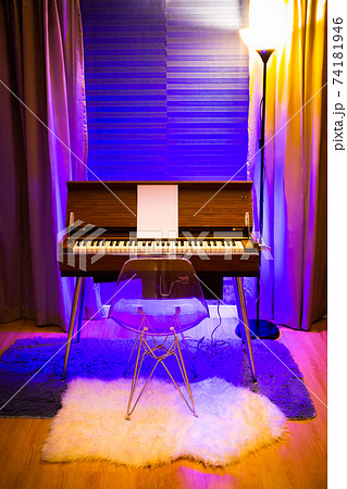 rare vintage reed organ in modern living room with colorful ambient light setting rare vintage reed organ in modern living room with colorful ambient light setting 74181946