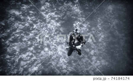 Above the abyss, a diver under water Above the abyss, a diver under water 74184174
