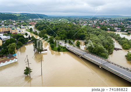 Aerial view of flooded houses with dirty water of Dnister river in Halych town, western Ukraine. 74186822