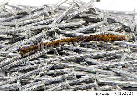 one old rusted and many new nails one old rusted and many new nails 74192624