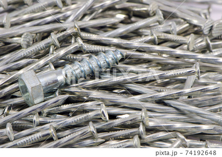 one screw nail on nails background one screw nail on nails background 74192648