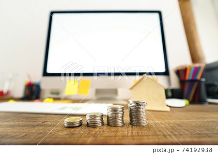 Save money at home,Saving money in front of the desk at home 74192938
