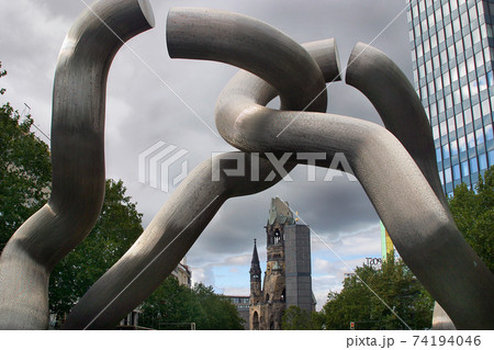 Berlin monument commemorating the city unification with the Kaiser Wilhelm Memorial Church and anti-war memorial in the background. Berlin monument commemorating the city unification with the Kaiser Wilhelm Memorial Church and anti-war memorial in the background. 74194046