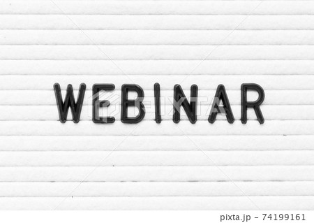 Black color letter in word webinar on white felt board background 74199161