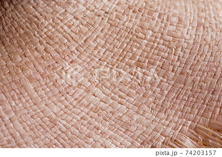 Traditional handicraft fabric, background texture of woven surface of straw 74203157