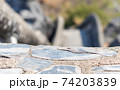 Concrete stone floor with a blurred background stairs down that is pathway down mountain. Sensitive focus. 74203839