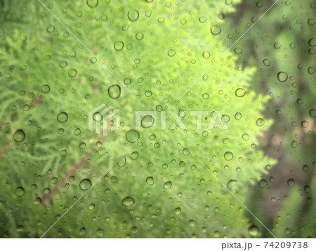 Close-up of water drops on glass surface as background 74209738