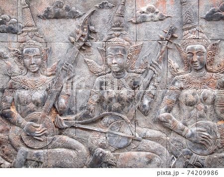 Native Thai culture stone carving on temple wall 74209986