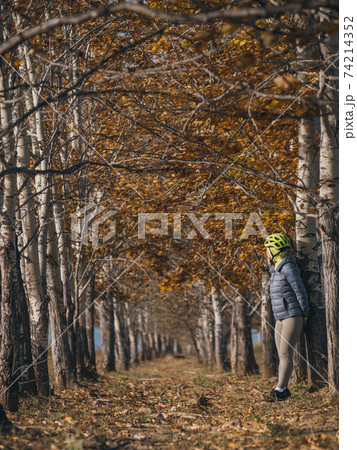 The woman travel on mixed terrain cycle touring with bikepacking. The traveler journey with bicycle bags. Sport tourism bikepacking. The woman travel on mixed terrain cycle touring with bikepacking. The traveler journey with bicycle bags. Sport tourism bikepacking. 74214352