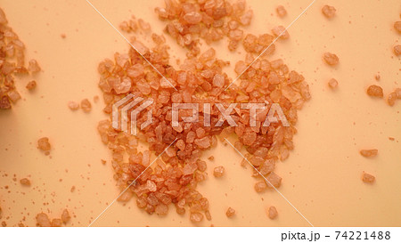 Sea bath salt background. Orange crystals of salt, beauty and spa concept Sea bath salt background. Orange crystals of salt, beauty and spa concept 74221488