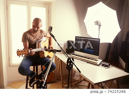 guitar player recording at home studio 74225266