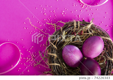 Colorful background with Easter eggs on pink background. Happy Easter concept. Can be used as poster, background, holiday card. Flat lay, top view, copy space. Studio Photo Colorful background with Easter eggs on pink background. Happy Easter concept. Can be used as poster, background, holiday card. Flat lay, top view, copy space. Studio Photo 74226383