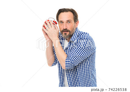 Im only young once. Mature man listening to clock ticking 74226538