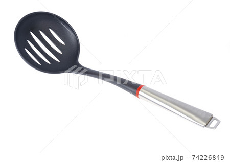 Kitchen utensils spoon with slots, slotted spoon isolated on white background. Studio Photo Kitchen utensils spoon with slots, slotted spoon isolated on white background. Studio Photo 74226849