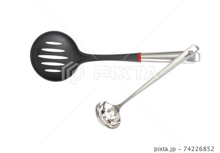 Kitchen utensils spoon with slots, slotted spoon isolated on white background. Studio Photo 74226852