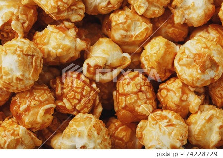 Popcorn in caramel glaze close-up as a background. 74228729